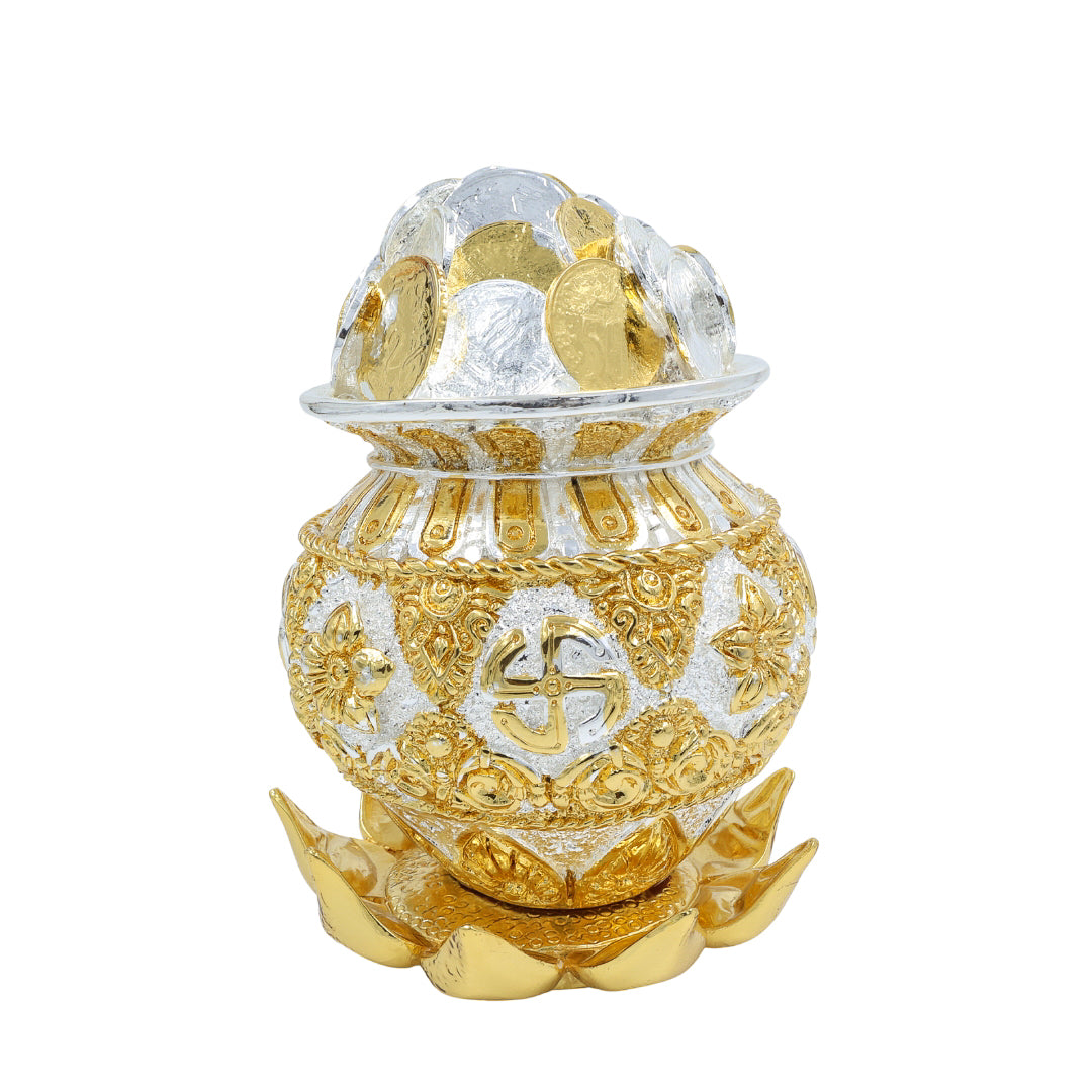 Golden and silver coin Kalash with embossed Swastik symbol on a decorative lotus tray – ideal for pooja, gifting, and Vastu decor.