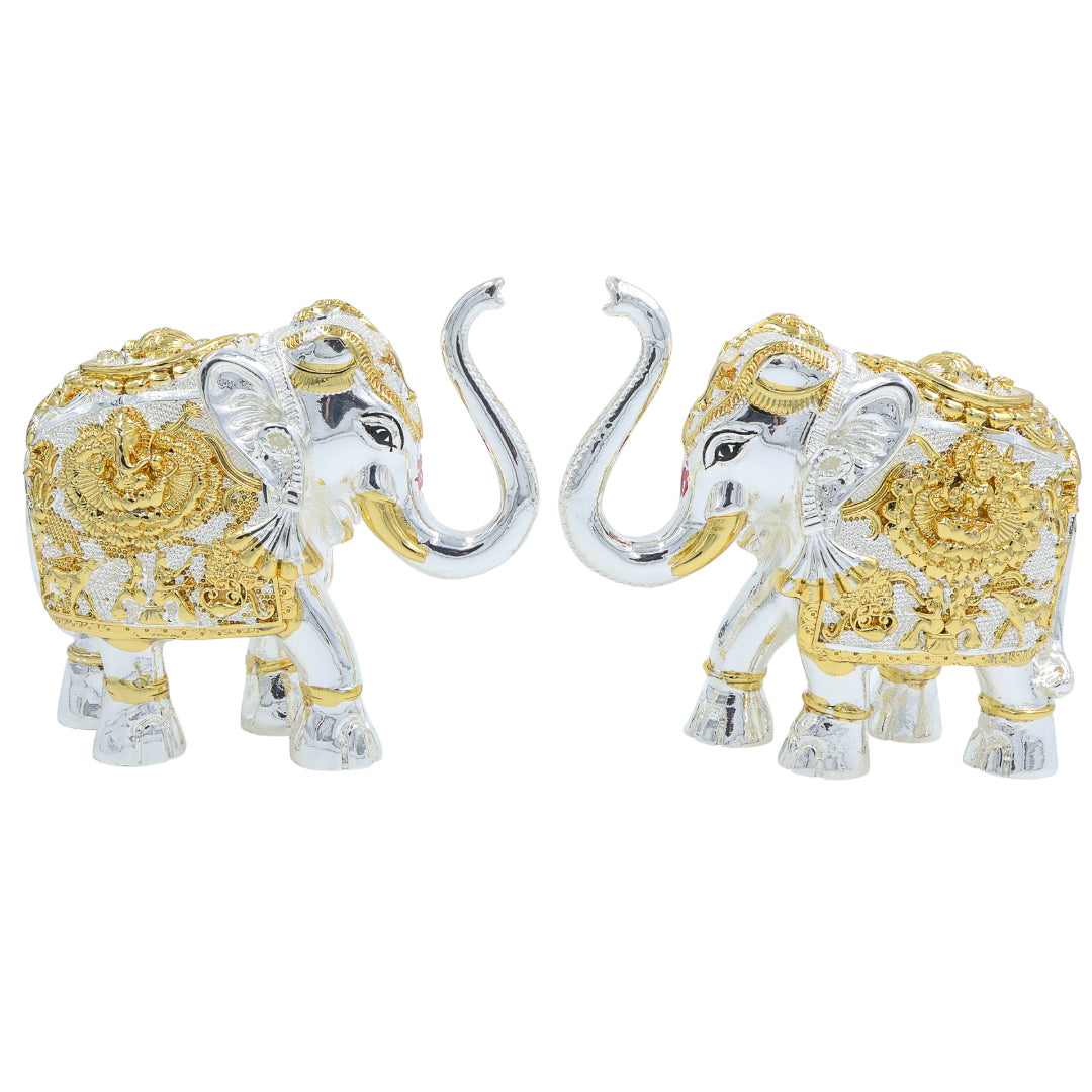 A pair of decorative elephants in gold and silver finish with trunks raised, symbolizing prosperity and strength – perfect for home decor or gifting.