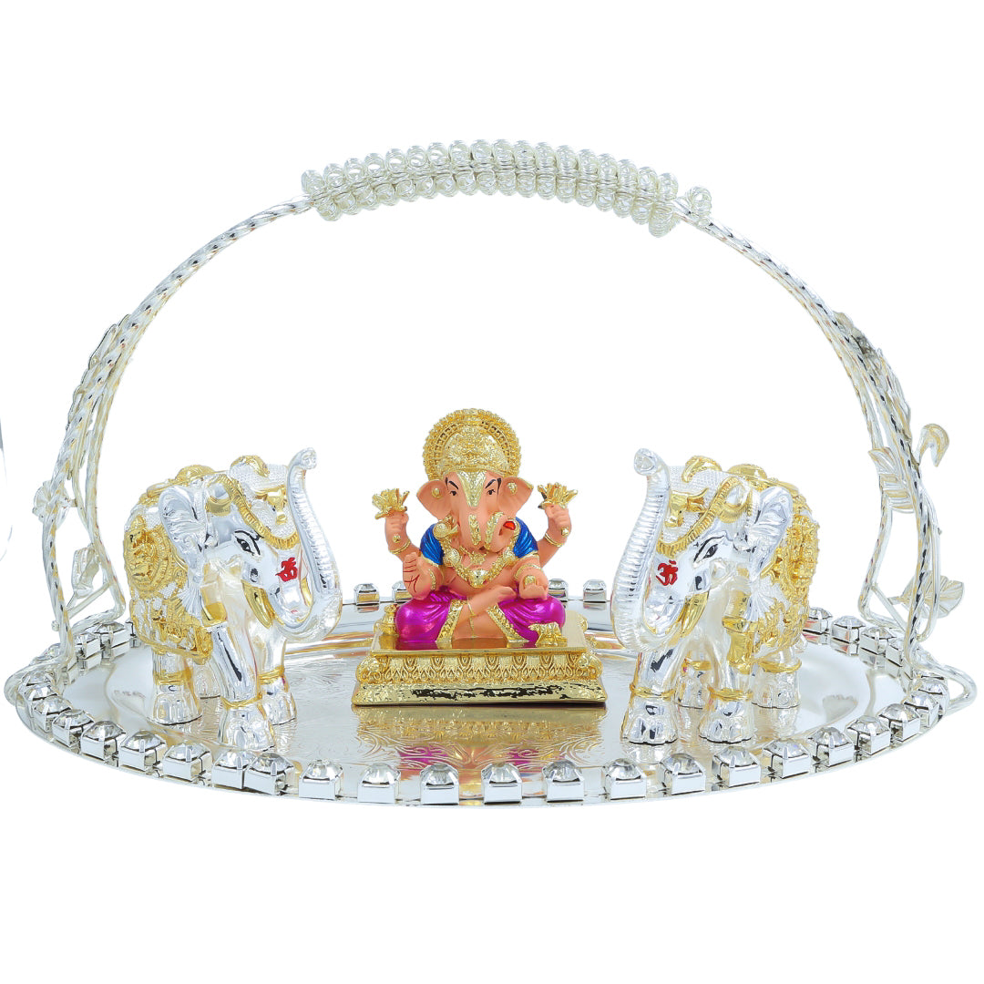 Ganesh idol seated on a crystal tray with two white and golden elephants – festive and spiritual home décor gift item.